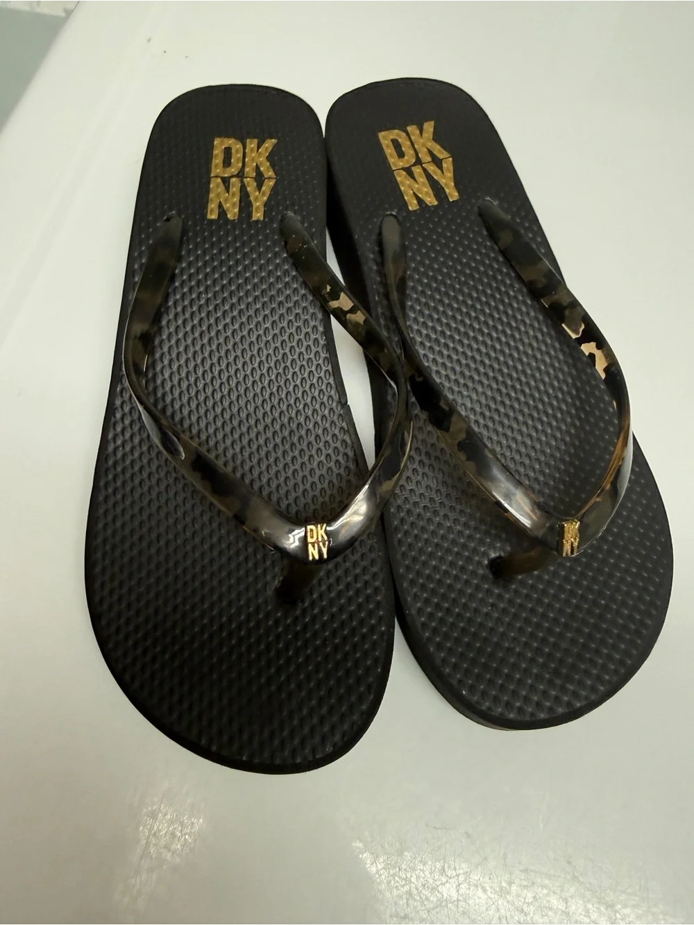 DKNY Black women size 6 Flip Flop Sandals with Gold Logo